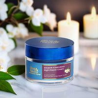 Shubhr Kumkumadi Night Repair Cream placed against a serene backdrop with flowers and lit candles.