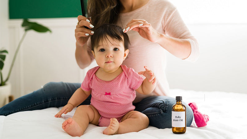 Mohter is combing her baby's hair after she applied natural baby hair oil 