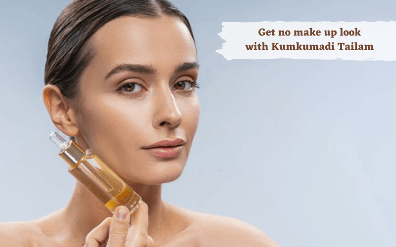 Lady is holding kumkumadi serum 