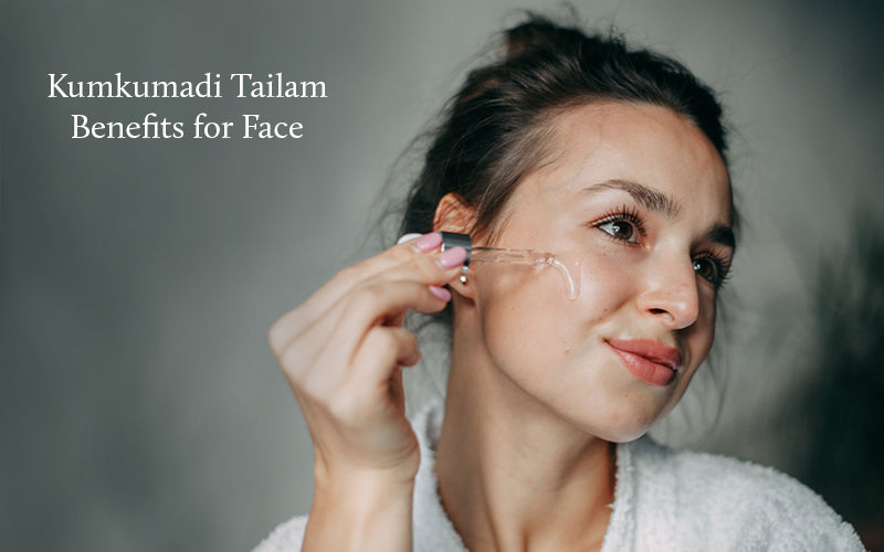 Lady is applying kumkumadi serum on her cheeks 