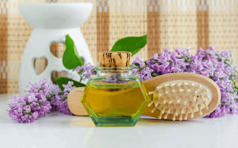 Ayurvedic oils for hair with comb and flowers 