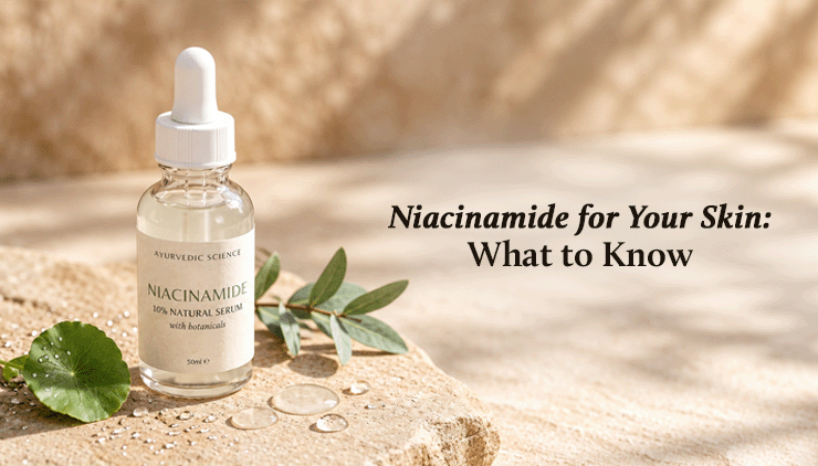 A niacinamide serum dropper bottle rests on sunlit stone with leaves and water droplets beside the text “Niacinamide for Your Skin: What to Know,” conveying a calm, natural skincare guide.