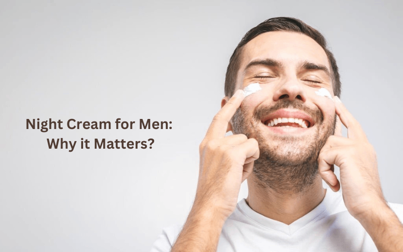 Men is applying night cream on his cheeks 