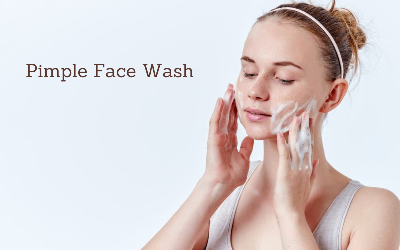 Lady is washing her face with pimple face wash 