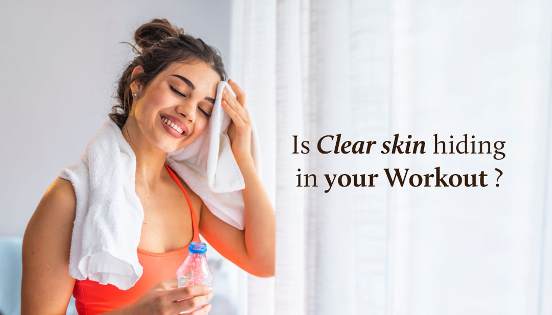 A woman smiles as she pats her forehead with a towel to wipe away sweat, while holding a water bottle in her other hand