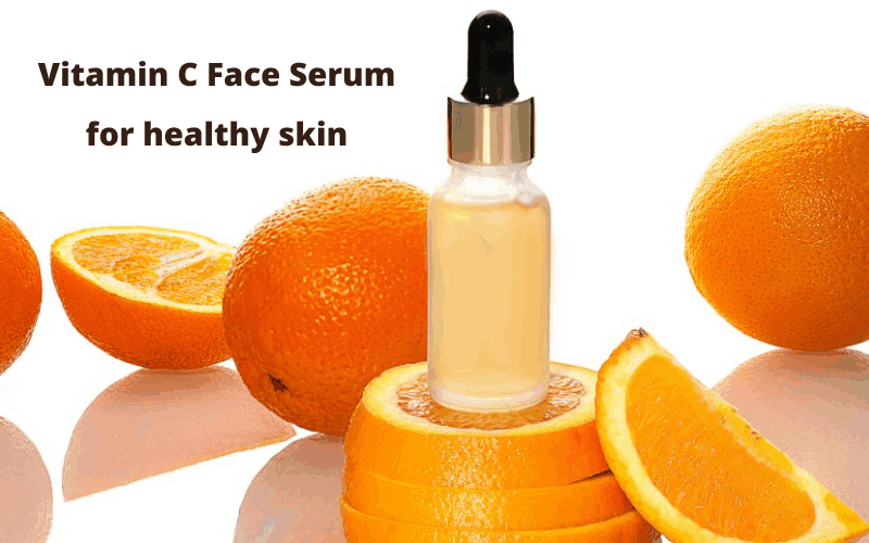 Vitamin C Face Serum bottle with oranges is kept on table 