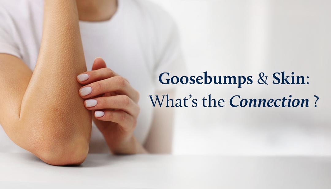 A woman gently touches her elbow, feeling the trail of goosebumps rising along her arm