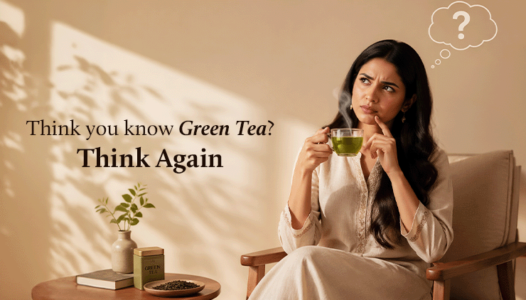 A woman in beige holds a steaming green tea cup, pondering with a thought bubble. Text reads "Think you know Green Tea? Think Again" beside a table with a plant.