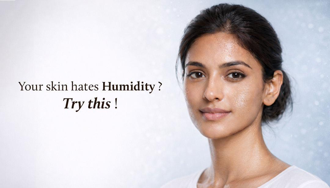 A smiling Indian lady looks straight into the camera, with humidity visibly reflecting on her face.