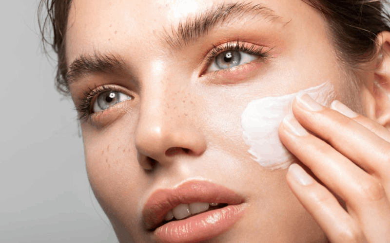 lady is applying night cream on her face 