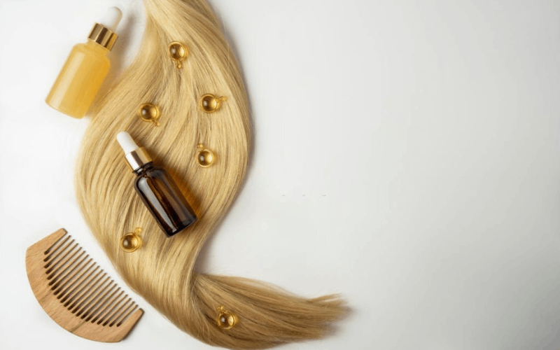 ayurvedic hair oil, serum, hairs and comb 