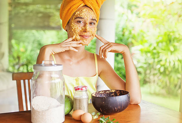 woman applying ubtan