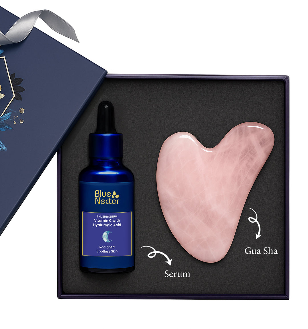 Vitamin C serum bottle next to a Rose Quartz gua sha facial massage tool.