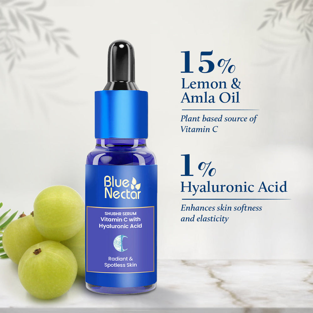 Vitamin C Serum bottle placed next to Amla on a white surface showa percentage of ingredients added.