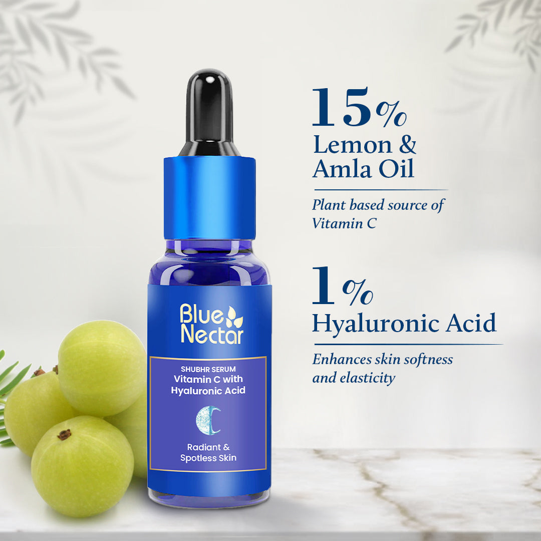 Vitamin C Serum bottle placed next to Amla on a white surface showa percentage of ingredients added.